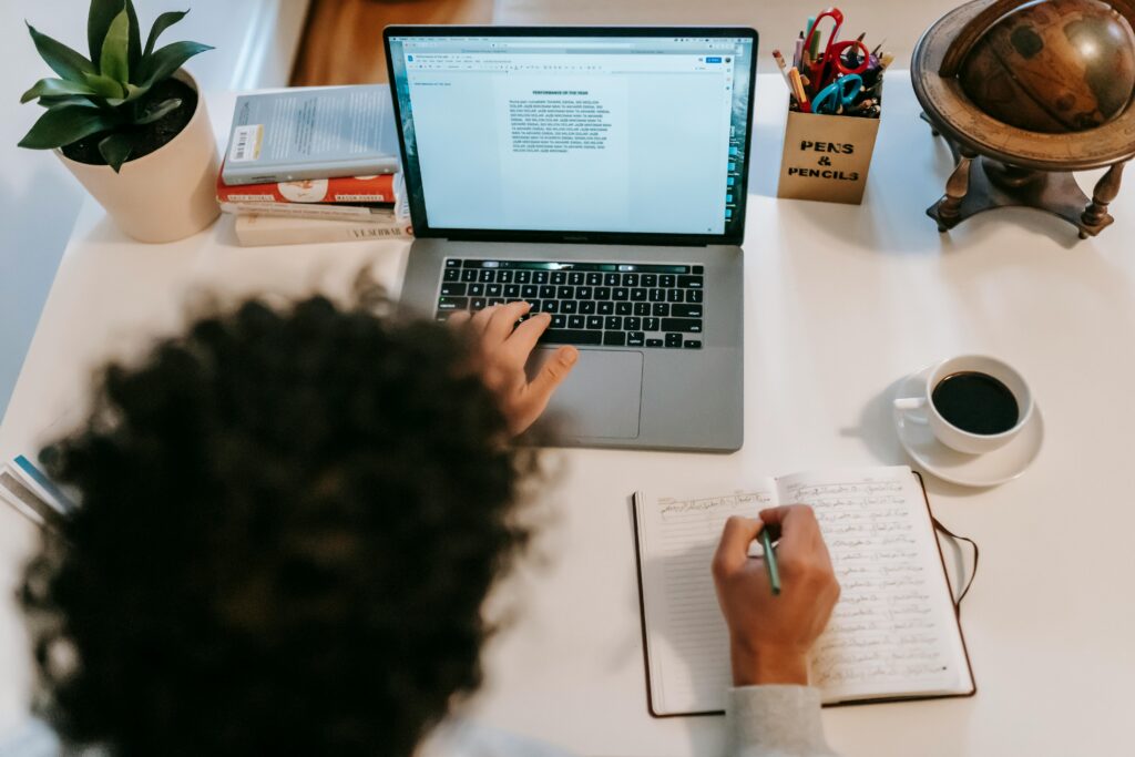 author typing on laptop